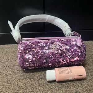 New coach night bag or make up pouch.